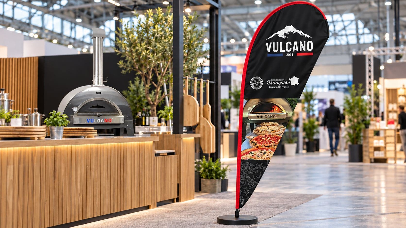 Drapeau publicitaire Vulcano avec photographie de pizzas, mis en scène sur un stand